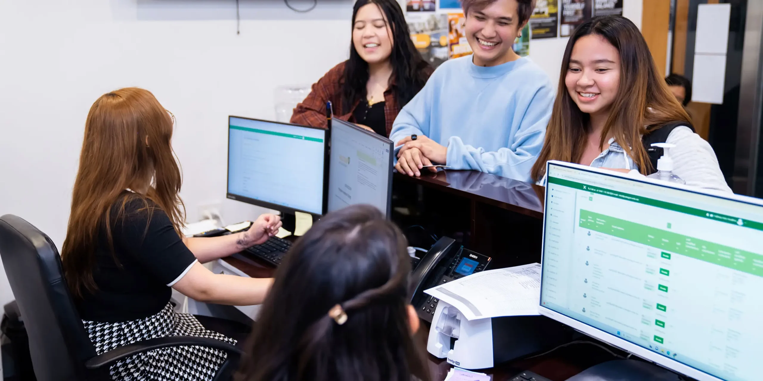 A group of students enjoying time with their colleagues while enrolled with Laurus Higher Education for career-focused courses.